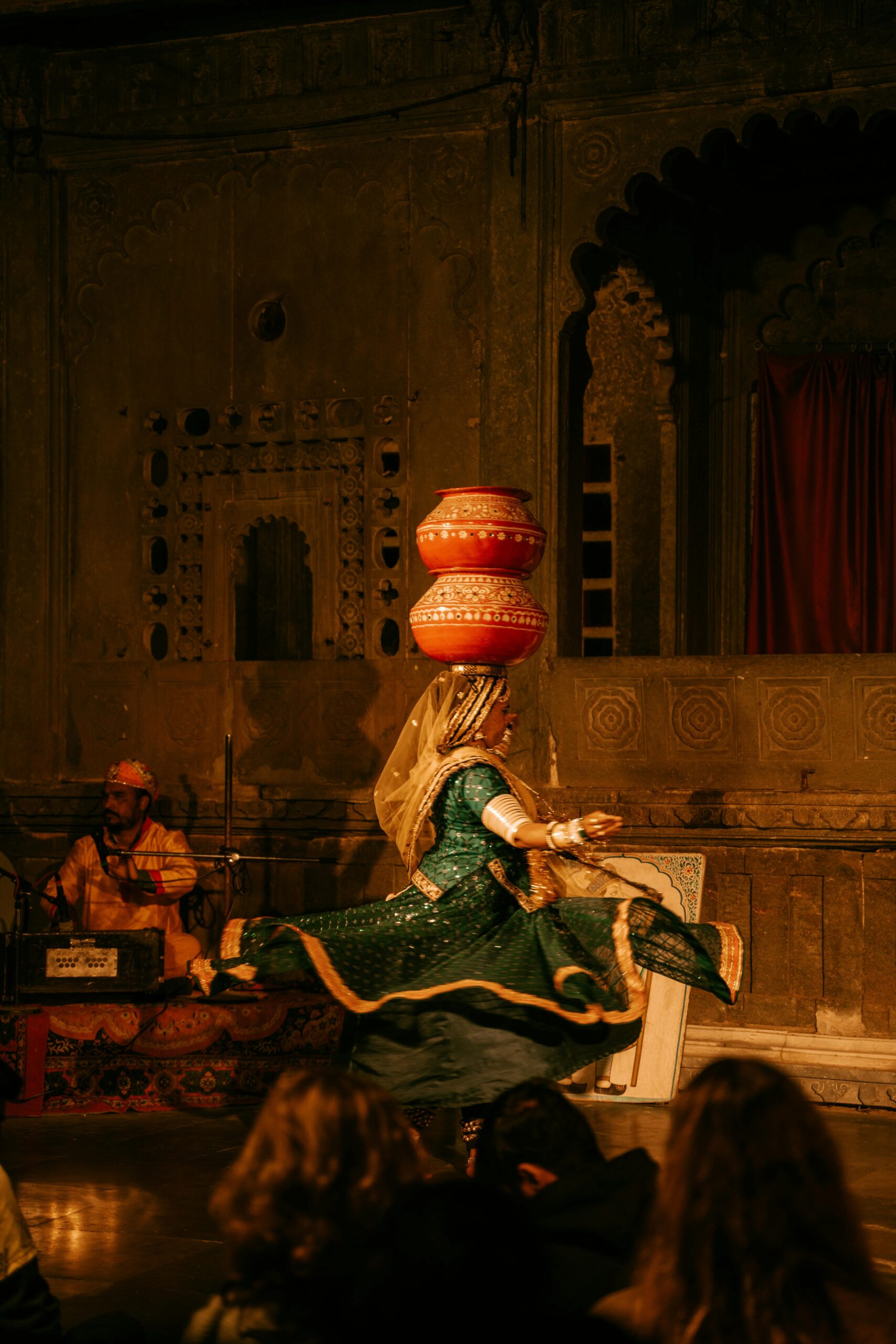 Indian dancer performing traditional dance indoors, showcasing cultural heritage.