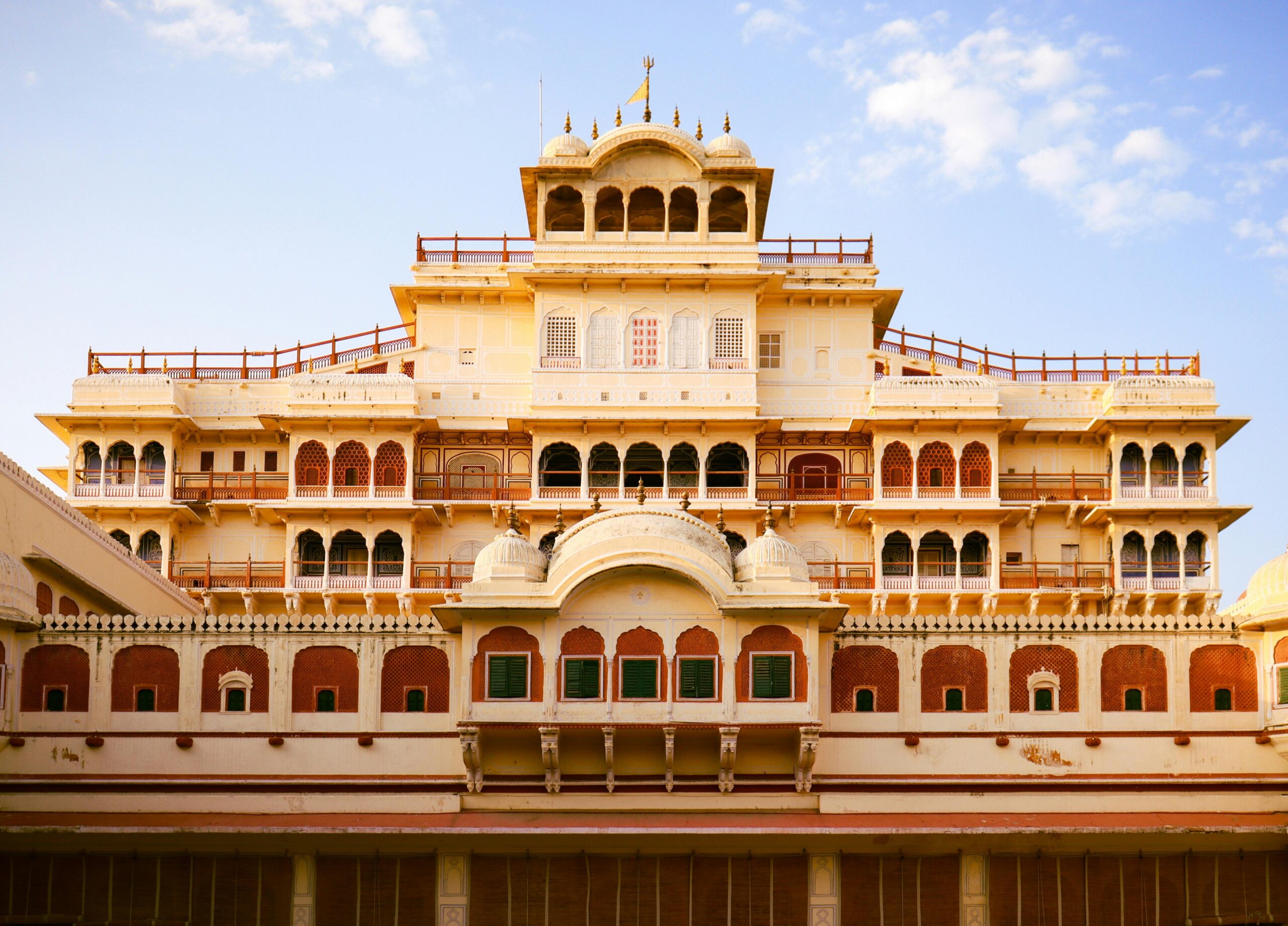 The stunning facade of the Chandra Mahal in Jaipur, showcasing Mughal architecture.